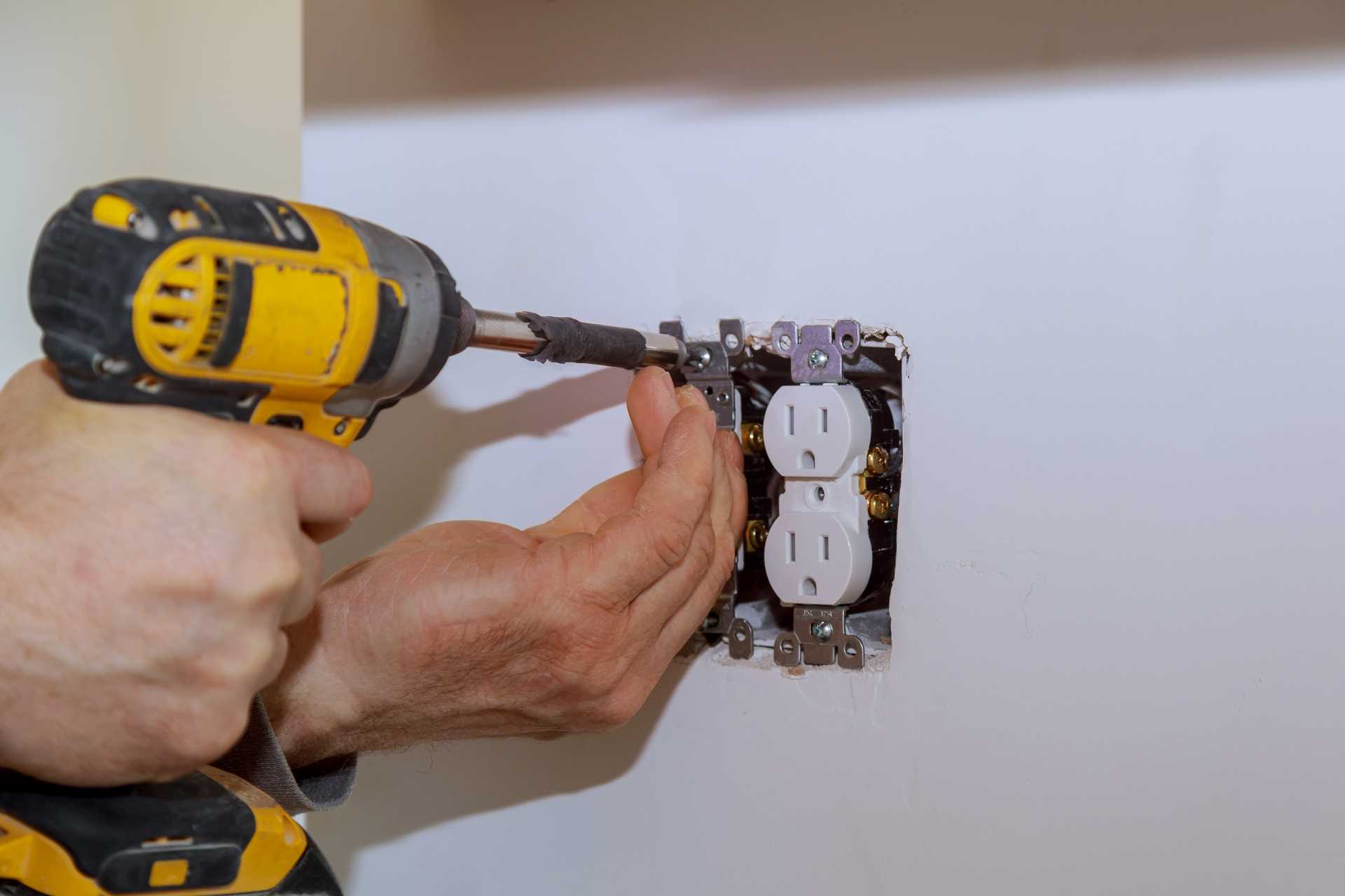 Power outlet being installed | Featured Image for the Residential Electrician Top Level Service Page of KTM Solutions.