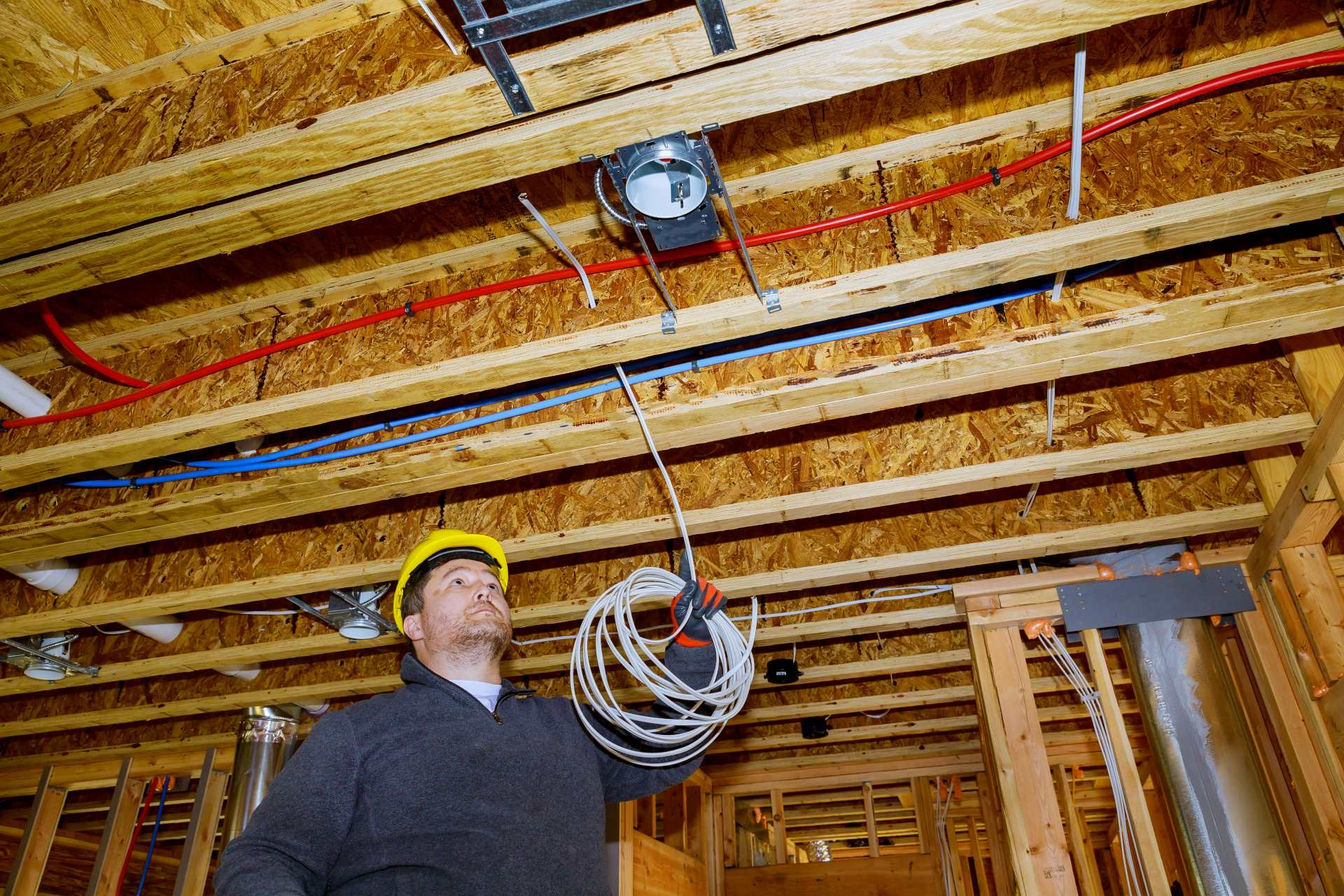 Electrician working with wires | Featured Image for the Residential Electrician Top Level Service Page of KTM Solutions.